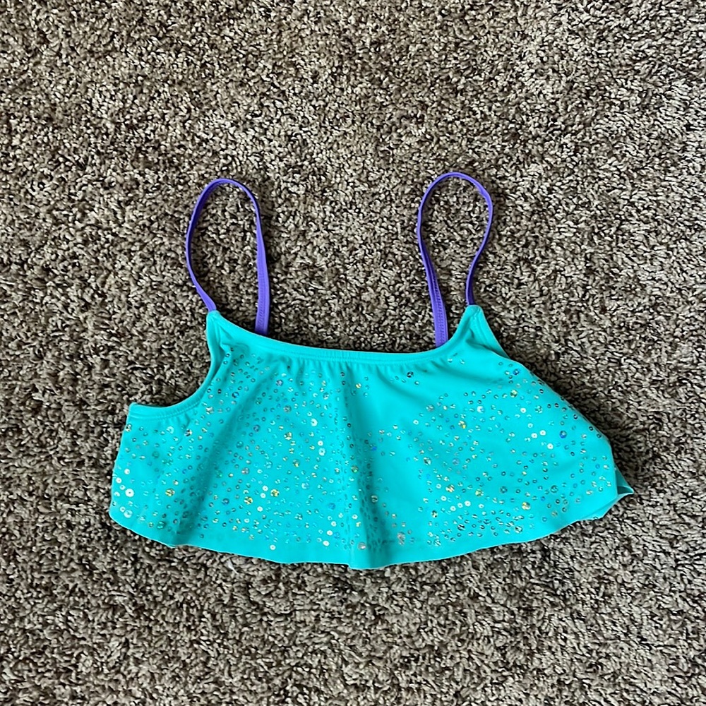 This is a kid bathing suit that includes sequence on the bathing suit top!